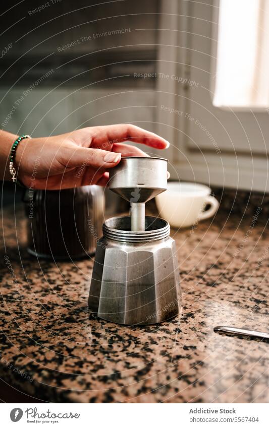 Assembling moka pot at home hand Italian coffee assembling kitchen counter blurred background kitchenware process beverage preparation young independent