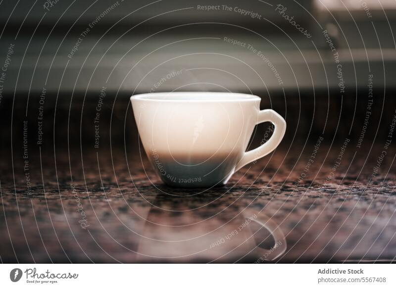 Steamed serenity cup steam coffee white countertop granite light ambient morning calm ritual ceramic handle beverage reflection surface shadow depth focus