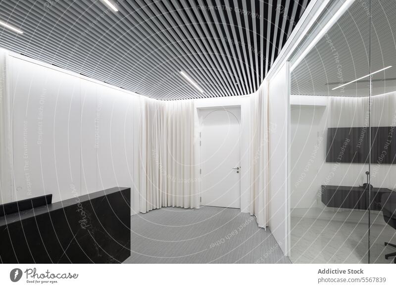 Modern reception area with striped ceiling Interior modern desk marble black white curtain drape design door elegance minimalist architecture space wall pattern