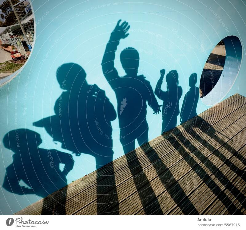 Shadow family photo in blue Blue Turquoise Parents warped Distorted Eerie Ghosts holes Light and shadow play Abstract Sunlight Silhouette Contrast shadow cast