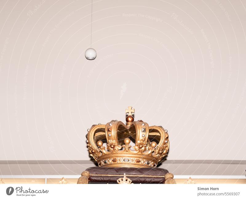 Elaborately decorated crown in a minimalist setting decoration Crown Monarchy Decoration Contrast segregated relic constitutional King Royal Historic museum