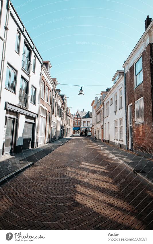 Typical historic town street in Zwolle in the east of the Netherlands. Exploring Dutch cities during daytime zwolle summertime religious vertical medieval