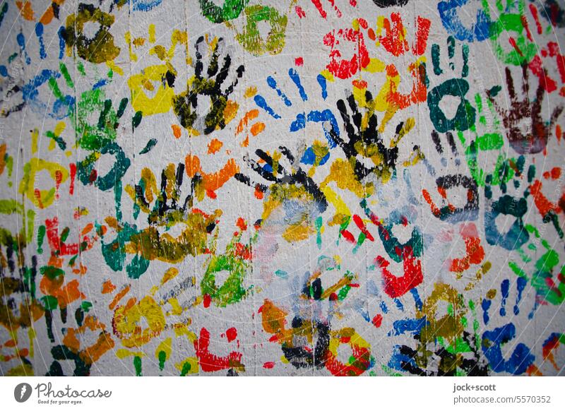 Hand for hand in hand Imprint Multicoloured Silhouette Agreed Structures and shapes handprint Symbols and metaphors Detail Touch Teamwork Play of colours