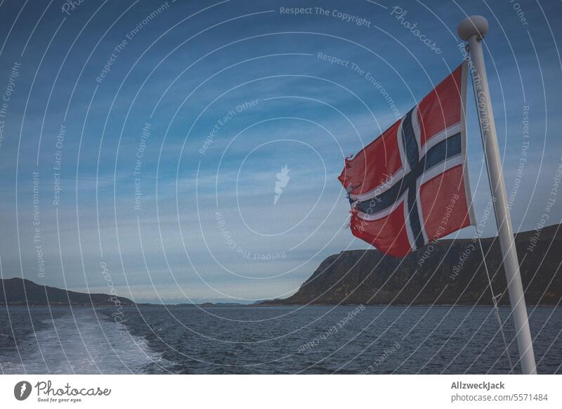 Norwegian flag on the stern of a ferry in Norway Water Ocean Beautiful weather Exterior shot Colour photo Navigation coast Horizon Scandinavia Nordic