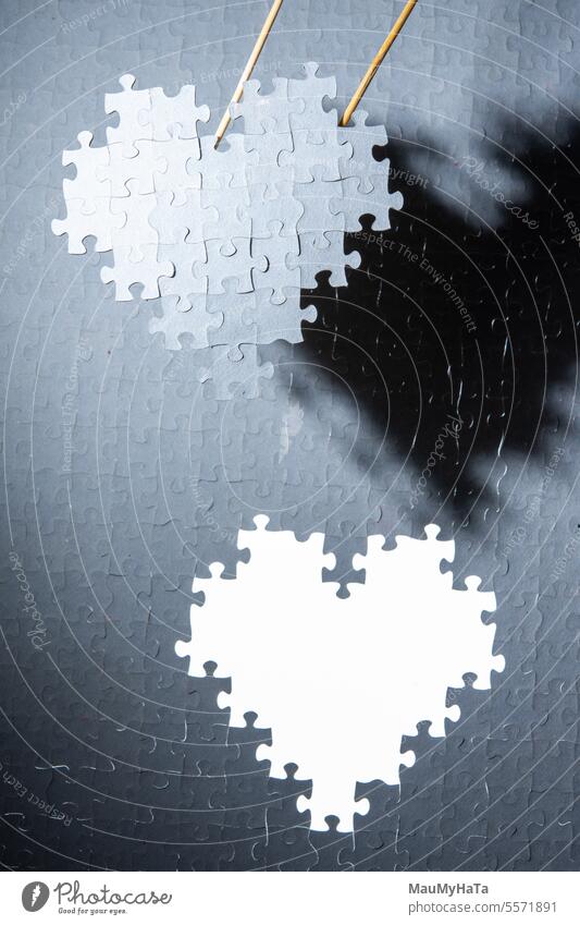 a heart made of puzzle pieces Heart Puzzle Playing Colour photo Intellect strategy Chess board background