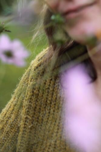 woman behind flowers. blur blurriness Woman Flower meadow Smiling Mouth Cardigan Pink Chin Neck Green Lips Human being Feminine