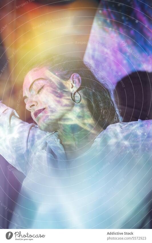 Woman in serene meditation under cosmic light infusion woman spiritual mental calm journey peace introspect reflection ethereal universe aura emotion balance