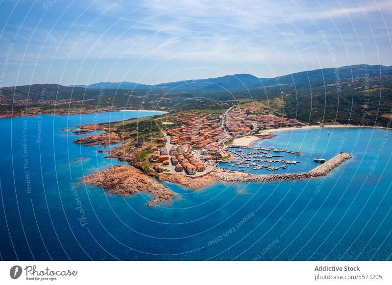 Top view of seaside town of Sardinia aerial view Castelsardo Isola Rossa Italy marina coast azure harbor Mediterranean buildings architecture boats waterfront