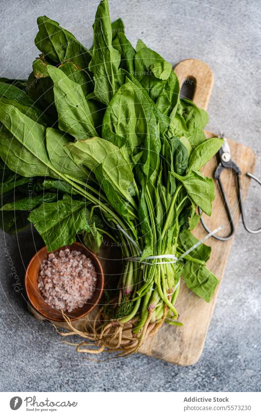 Spinach and spices on board spinach bowl rustic fresh green leaf vegetable aromatic salad wood health ingredient organic culinary preparation cuisine gourmet