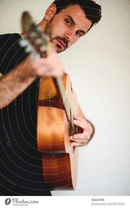 Helpful | practicing - Man plays guitar Practice Music Guitar Musician Musical instrument Make music Sound Acoustic Musical instrument string