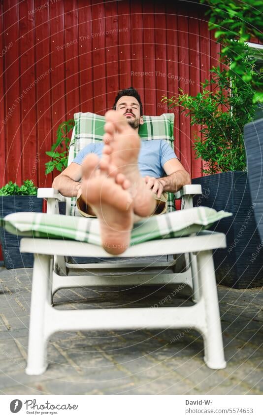 Rest and put your feet up put one's legs up rest Man Break tranquillity To enjoy Garden chill time-out garden lounger Contentment Serene Goof off relax Summer