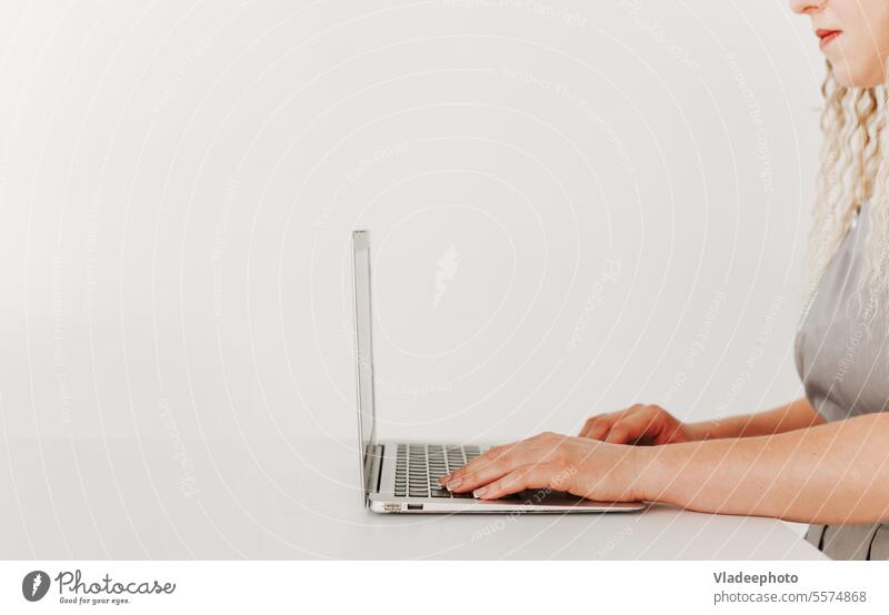Woman working with laptop, side view, white background, minimalism computer business typing press finger button desktop keyboard technology creative office