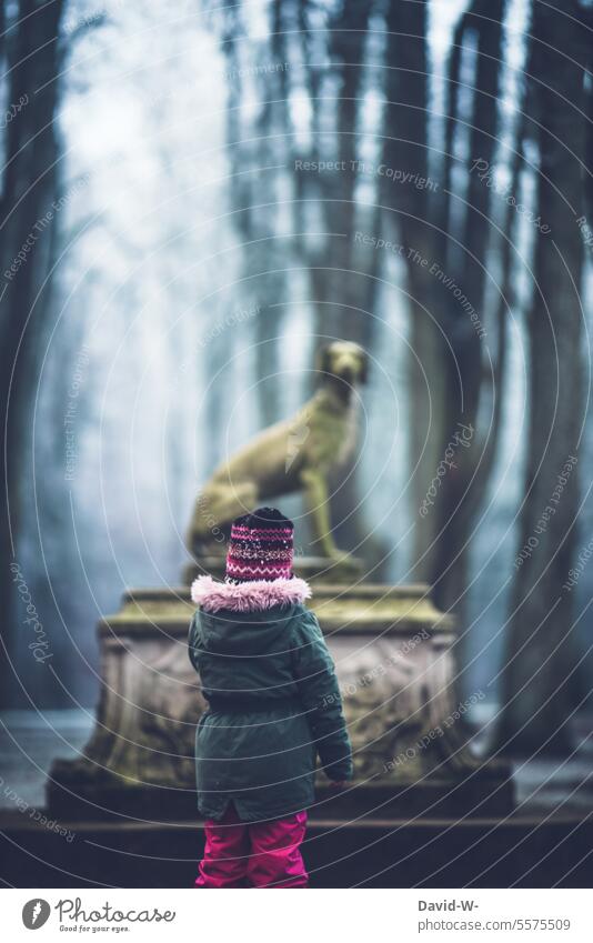 Child explores the mystical surroundings Curiosity Mystic Statue Winter To go for a walk Eerie Forest somber Fear awe Dark Mysterious Fog on one's own