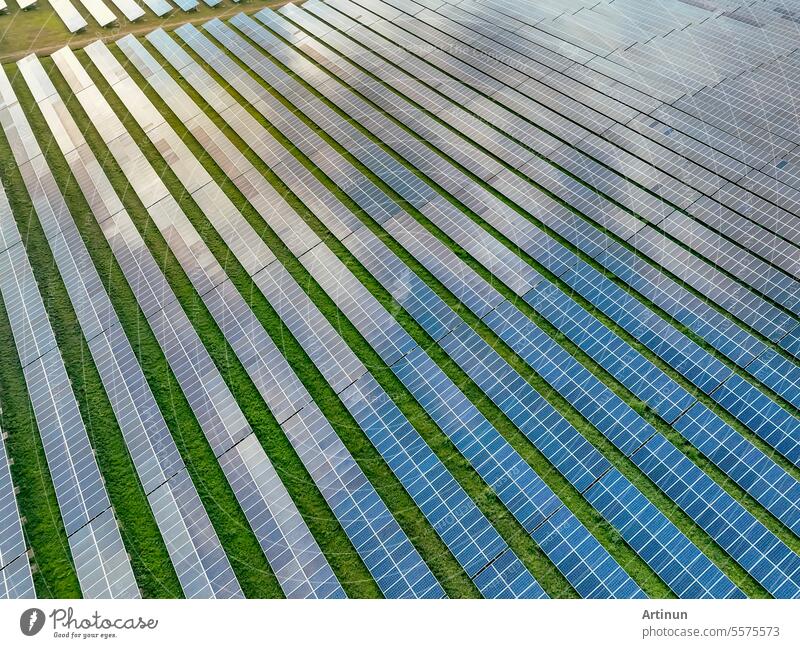 Aerial view of solar farm. Solar power for green energy. Sustainable resources. Solar cell panels use sun light as a source to generate electricity. Photovoltaics or PV. Sustainable renewable energy.