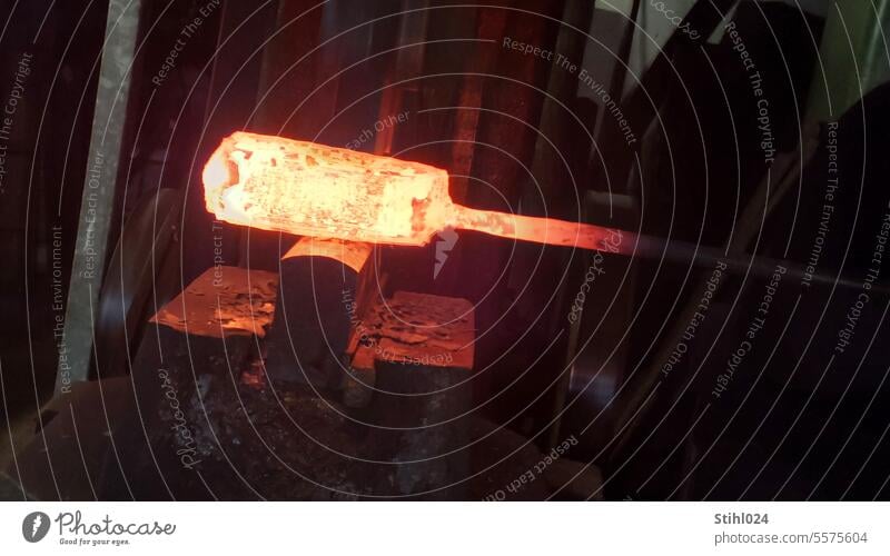 You should strike while the iron is hot Iron Forge Forging hammer Spring hammer Smithy Red hot Incandescent metalwork Metalworking forming technology transform