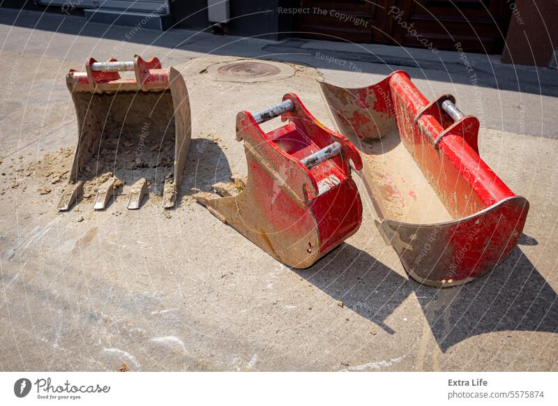 Low view on excavator's buckets, various types, different sizes and purpose Arsenal Backhoe Blade Bucket Building Site Civil Engineering Collection Construction