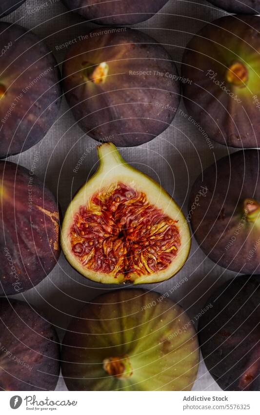 Minimalist composition with figs half fruit delicious napkin healthy food fresh sweet treat exotic tropical table ripe yummy dessert nutrition vitamin organic