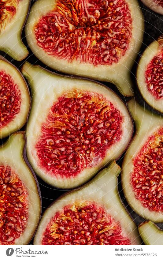 Composition with cut figs half fruit delicious healthy food fresh sweet treat exotic tropical ripe yummy dessert nutrition vitamin organic piece natural tasty
