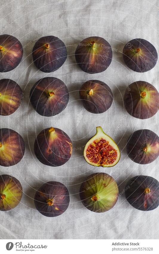 Minimalist composition with figs half fruit delicious napkin healthy food fresh sweet treat exotic tropical table ripe yummy dessert nutrition vitamin organic