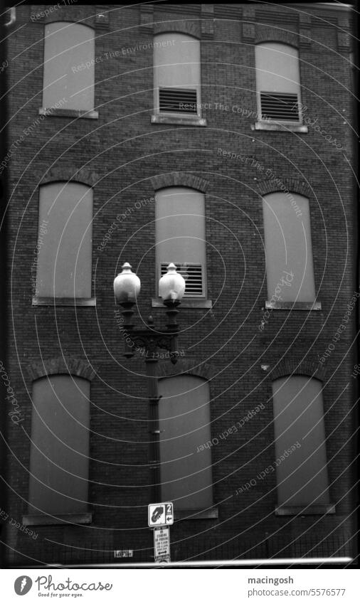 Old brick facade with street lamp in Washington, D.C. Facade Houses facade Wall (barrier) Historic streetlamp Contrast black-and-white Exterior shot Deserted