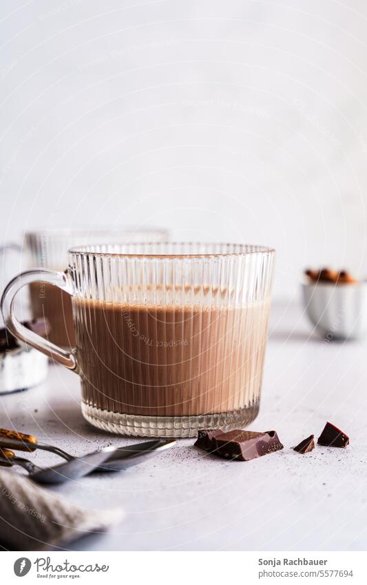 A glass of hot chocolate on a gray table. Close-up. Hot Chocolate Hot drink drinking glass Food Delicious Food photograph cute Interior shot Brown Milk Dessert