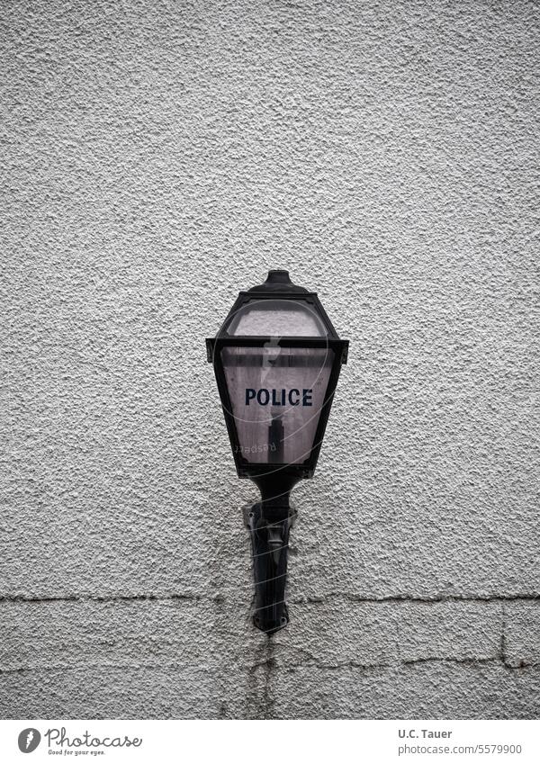 Light on police building, English inscription "Police" Police Force Wall (building) Gray Lamp Outside lights Facade