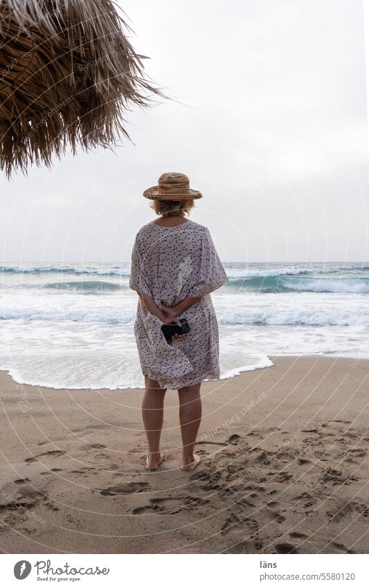 What comes what stays Beach Woman Sand Vacation & Travel overcast sky Clouds coast Crete Tourism Greece Mediterranean sea Ocean Waves Longing expectant vacation