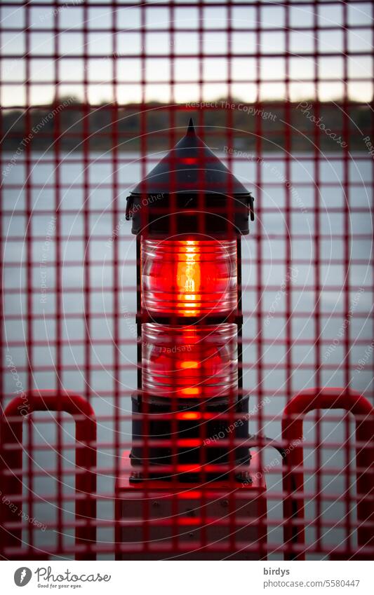 barred red position light on the Elbe Navigation Safety visibility red light Red Nautical Water Beacon latticed bank Grating Illuminate