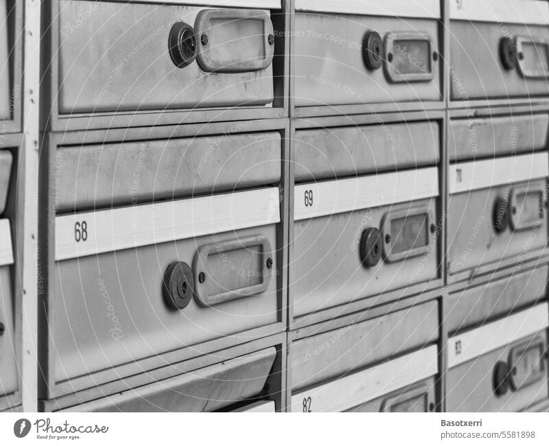Anonymous, numbered letterboxes, black and white photo Mailbox mailboxes Numbers Black & white photo Exterior shot Close-up extortion Detail Deserted Day Write
