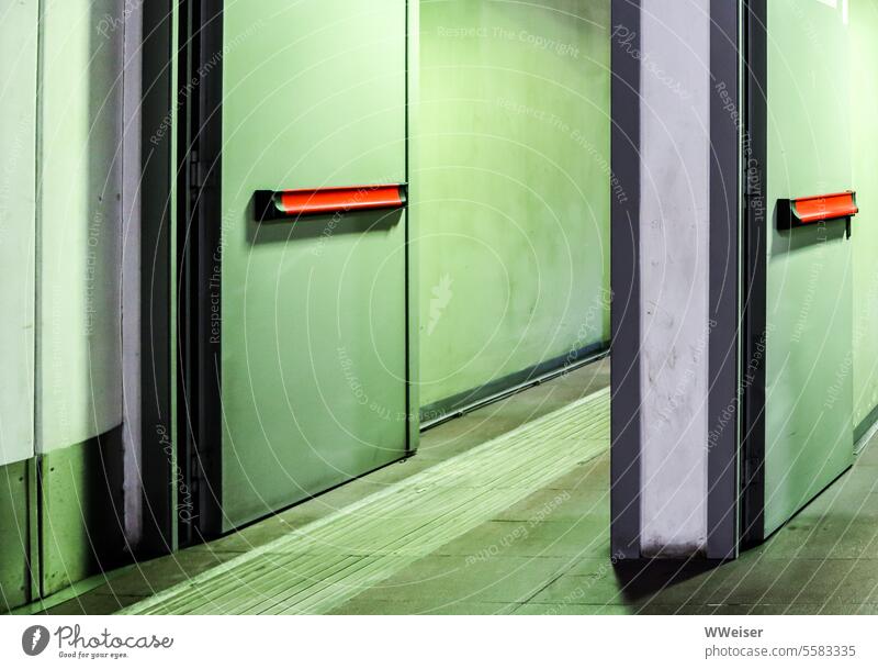 Public space, perhaps an entrance, illuminated in green, dirty and forbidding doors Corridor Stairs Entrance Way out Room inboard inside handles Door handles