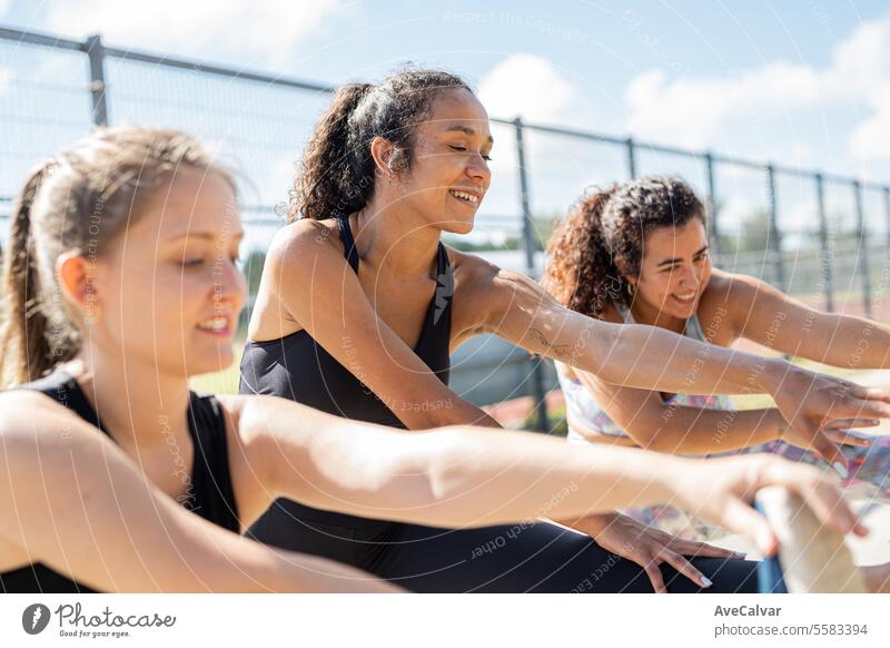 Diverse group of friends training together during sunny day.Body positive all shapes are valid. gym smiling people fitness exercising healthy happy athletic