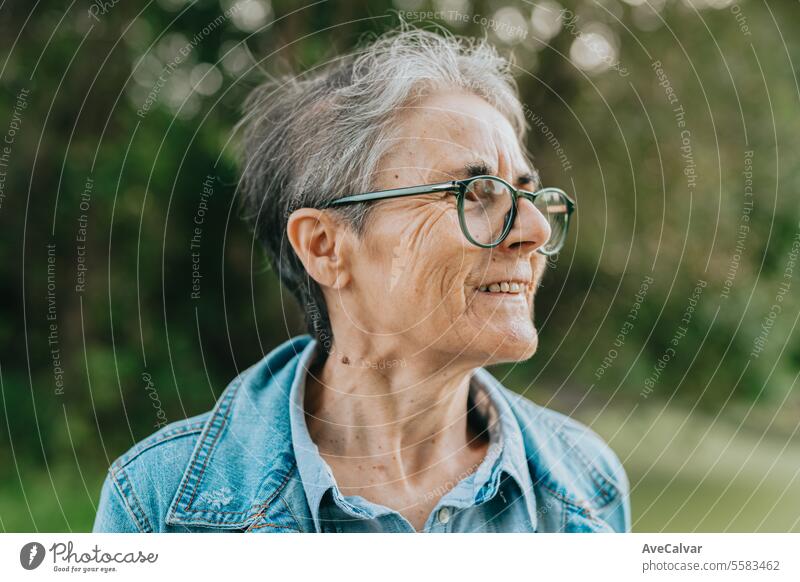 Senior smiling woman going on a trip after retiring, resting while looking at the magnificent sights mental retirement adult person old mature senior portrait