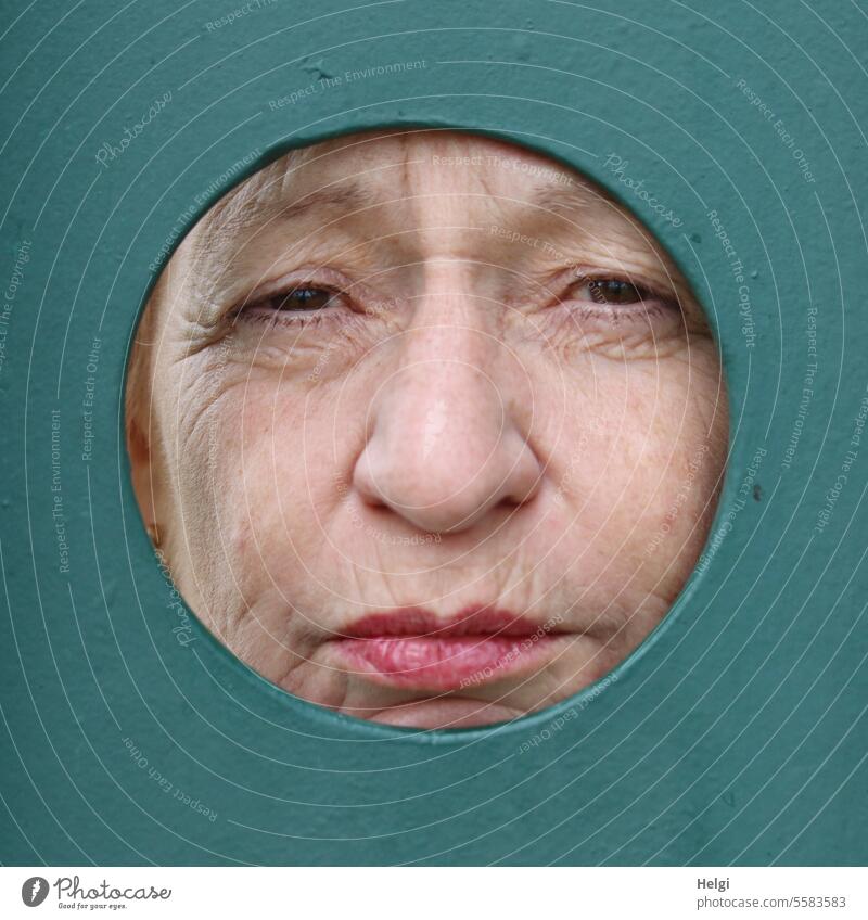 Autumn time | grim look through the peephole Human being Woman Face Metal Hollow Vista Ferocious Looking portrait Colour photo Looking into the camera Eyes