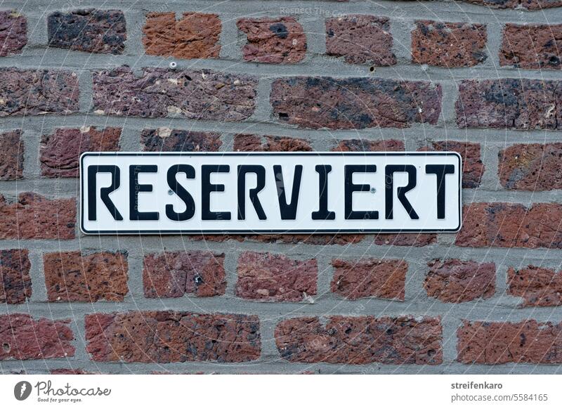 standoffish sign Reservation Reserved exclusively brick wall Parking lot Signs and labeling Signage Wall (building) Clearway Clue Bans Characters keep Private