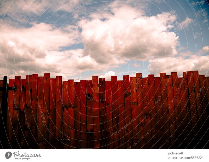 a picket fence in front of the clouds Fence Clouds Sky before that Low-key Neutral Background demarcation Hurdle Beautiful weather Copy Space Border background