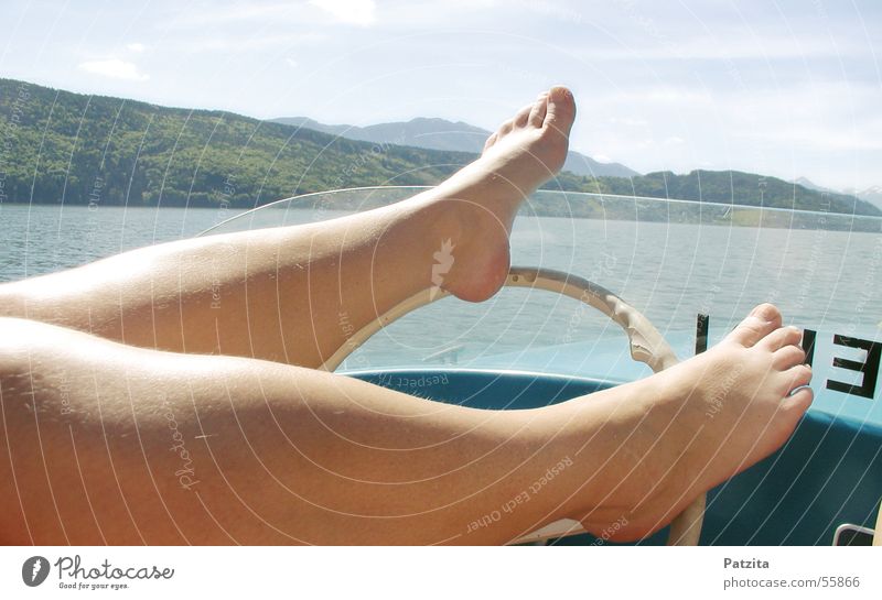 Foot handlebars Lake Steering wheel Watercraft Driving Conduct Toes Feet Mountain Sky Skin Legs Barefoot