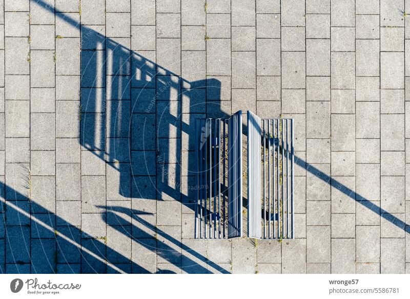 Two benches with long shadows from a bird's eye view Bird's-eye view Shadow play shadow cast Light and shadow Sunlight Pattern natural light daylight