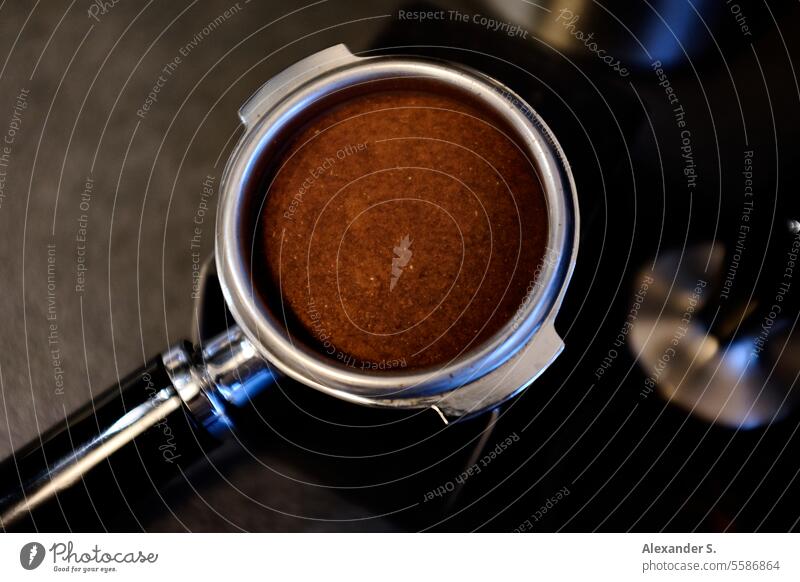 Sieve holder of an espresso machine, filled with coffee powder screen carrier Coffee powder Espresso screen carrier machine Espresso machine Coffee maker
