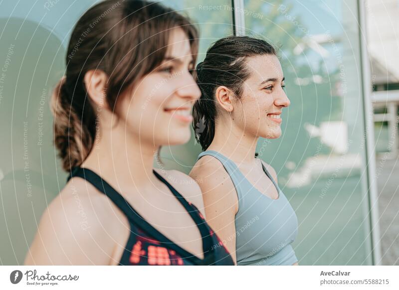 Close-up of smiling adult women in sports clothing, healthy and sporty lifestyle, fitness, outdoors. young female person caucasian exercise active urban friends