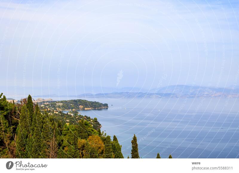 View from the former villa of Empress Sissi Achilleion over forests of cypress and olive trees to the city of Corfu Beaches Byzantine churches Corfu Town