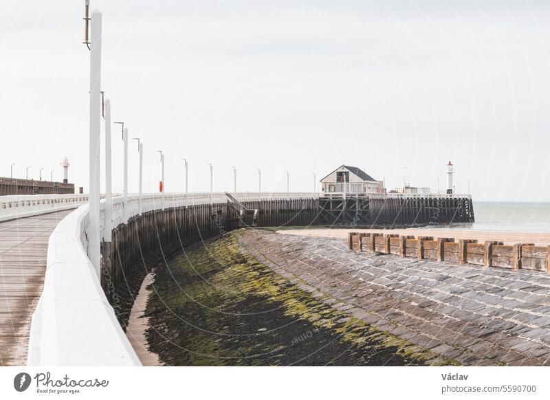 Wooden white pier topped with a lighthouse in Blankenberge, coast of Belgium blankenberge belgium belgium landscape roof dusk illuminated resort structure