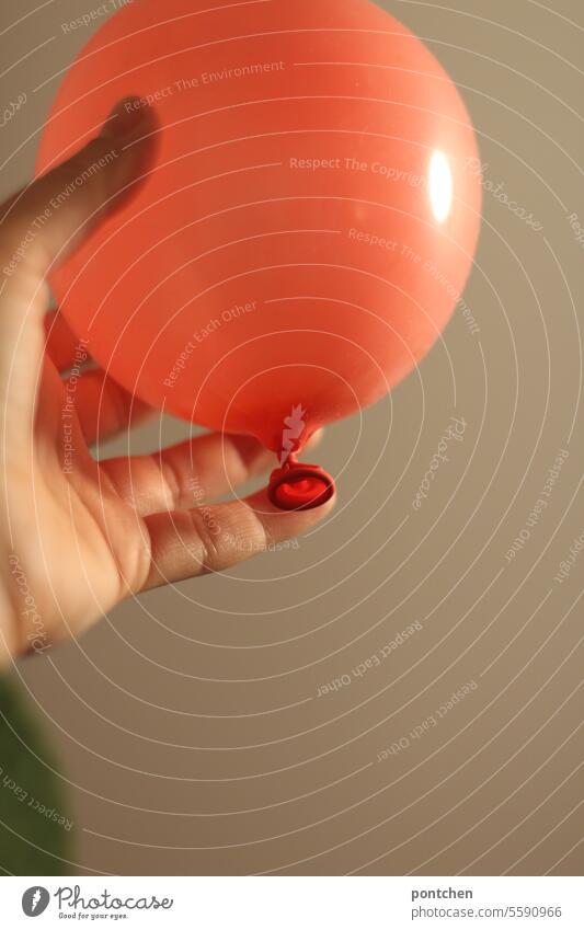 hold on and let go. a hand on a red balloon To hold on Release Divide relation Emotions Love Relationship Balloon Red Hand symbol picture Hover Fear Safety