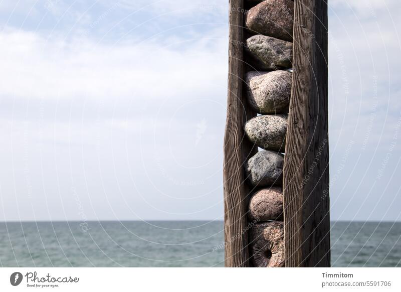 Horizontal and vertical Art Work of art Wood stones Baltic Sea Water Ocean Sky Blue Clouds Vacation & Travel Deserted Colour photo Vertical lines