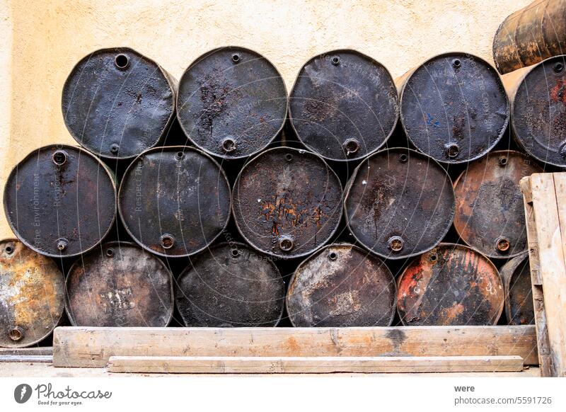 Various black tarred oil drums stacked in three rows on the island of Corfu Beaches Byzantine churches Corfu Town Crystal clear waters Culture Greece
