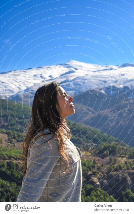 latina woman,long hair,breathing fresh air at the top of the mountain,sierra nevada spain Latin woman Travel Destinations Vacations altitude andalucia