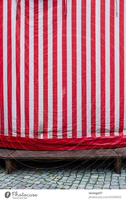 Red and white striped cladding Envelop concealment red-white-striped Reddish white ride Carousel Christmas Fair Exterior shot Colour photo Fairs & Carnivals