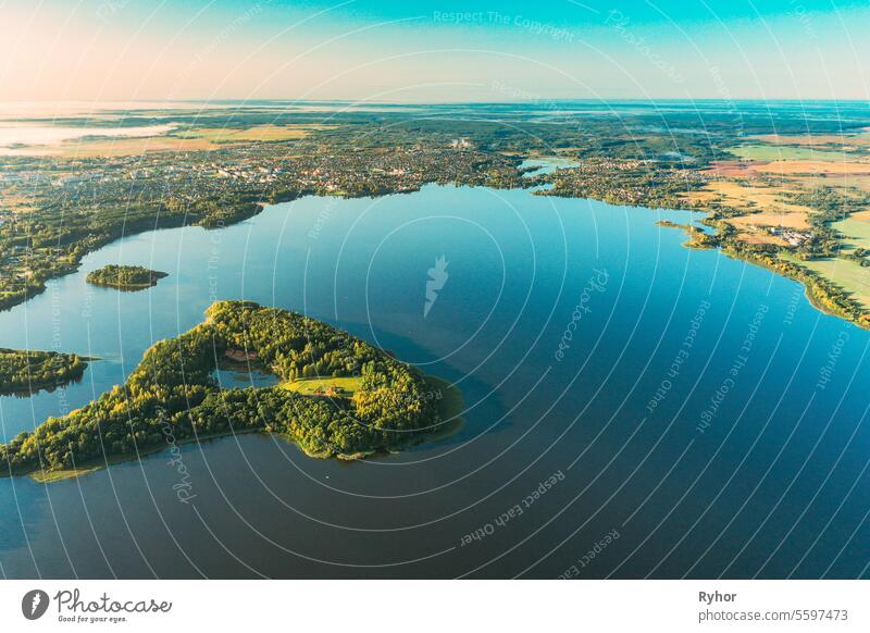 Lyepyel, Lepel Lake, Beloozerny District, Vitebsk Region. Aerial View Of Island Pension Lode In Autumn Morning. Morning Fog Above Lepel Lake. Top View Of European Nature From High Attitude In Autumn. Bird's Eye View Of Lyepyel Cityscape Skyline