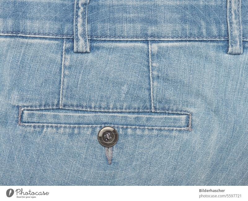 Detail of light blue denim trousers with trouser pocket and belt loop Jeans Bag Trouser pocket trouser button Belt loop Stitching Back pocket trouser seam Denim