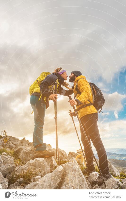 high mountain trekking woman adult kiss hike sport top couple love walking backpack people travel explore landscape view young holiday weekend activity climb