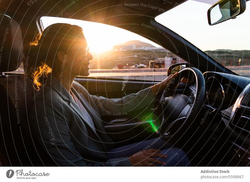 Happy businesswoman in sunglasses driving car executive portrait smiling beautiful young driver seat dashboard steering wheel happy entrepreneur